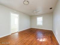 unfurnished room with hardwood / wood-style floors