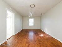 spare room featuring hardwood / wood-style flooring