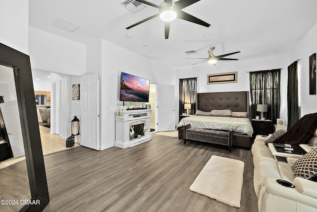 bedroom with ceiling fan and wood-type flooring