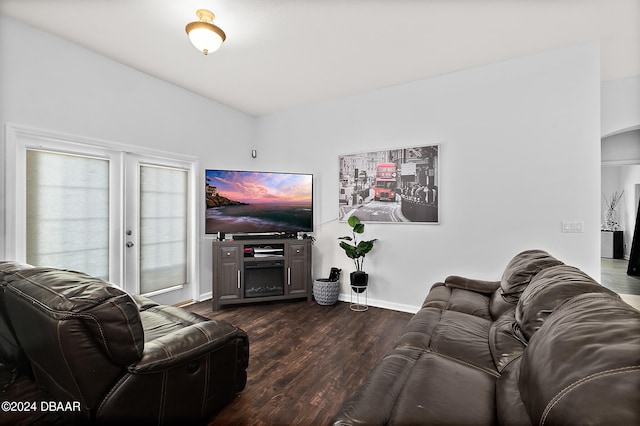 living room with dark wood-type flooring and french doors