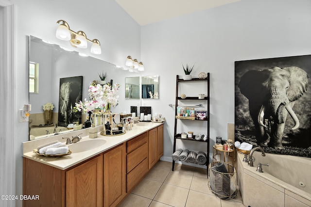 bathroom featuring tile patterned floors, vanity, and a bathing tub