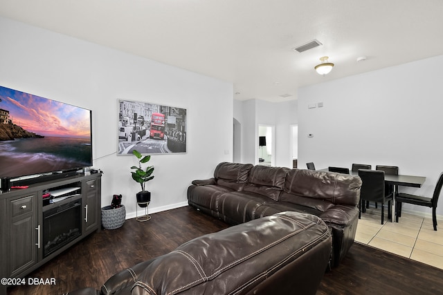 living room featuring dark wood-type flooring