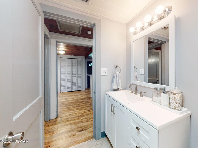 bathroom with vanity and wood-type flooring