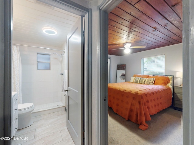 bedroom with ceiling fan and wood ceiling