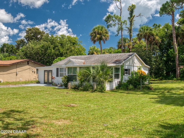 ranch-style house with a front yard