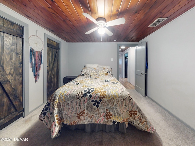 bedroom with light colored carpet, ceiling fan, and wood ceiling