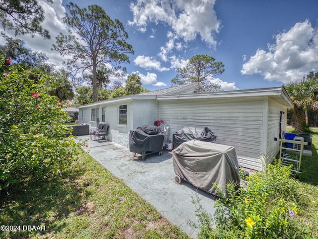 rear view of house with a patio