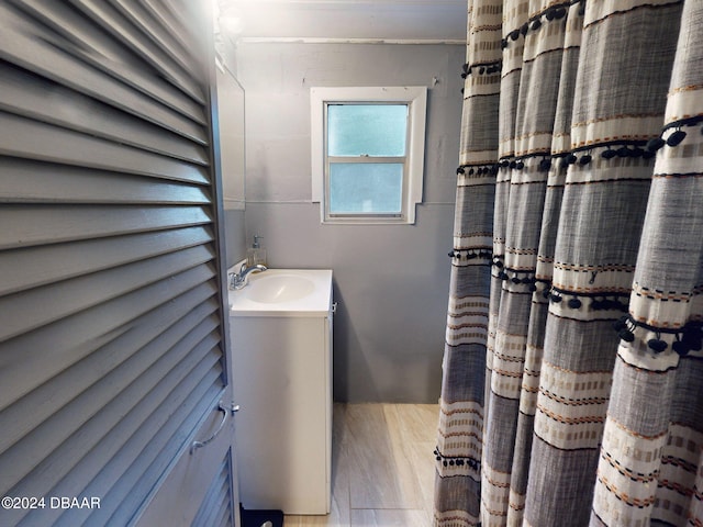 bathroom featuring vanity and hardwood / wood-style flooring