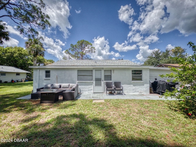 back of property featuring outdoor lounge area, a yard, and a patio