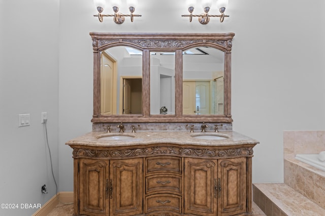 bathroom with vanity and a chandelier