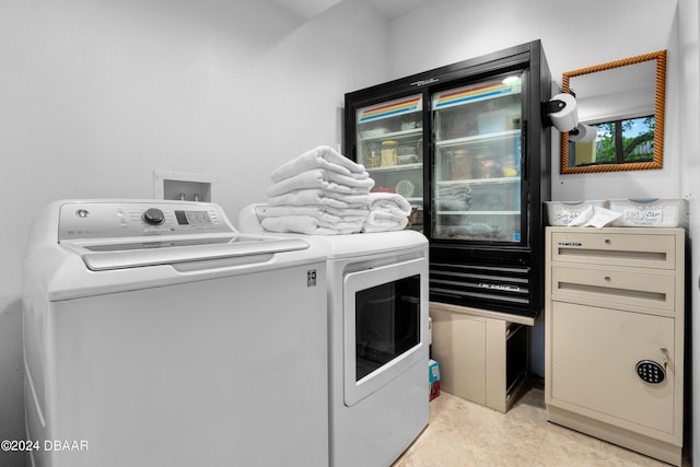 washroom with independent washer and dryer