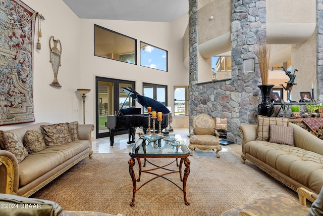 living room with a towering ceiling