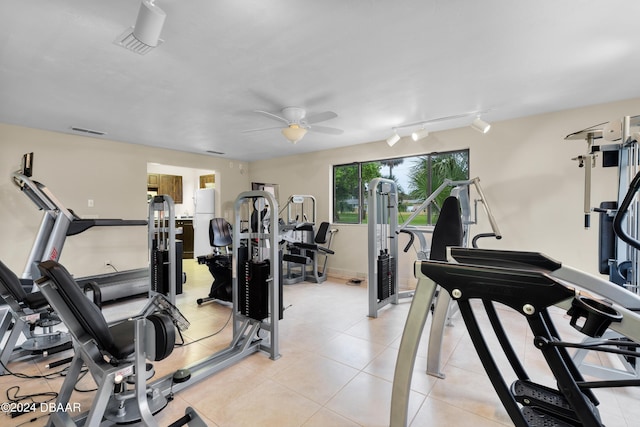 gym with rail lighting and ceiling fan