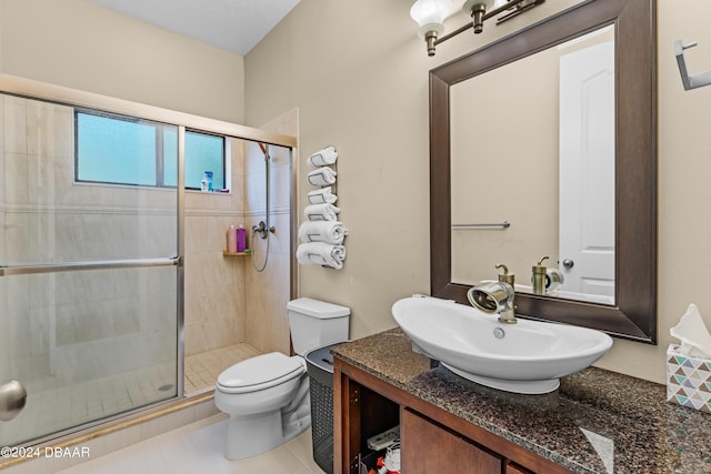 bathroom with vanity, toilet, and walk in shower