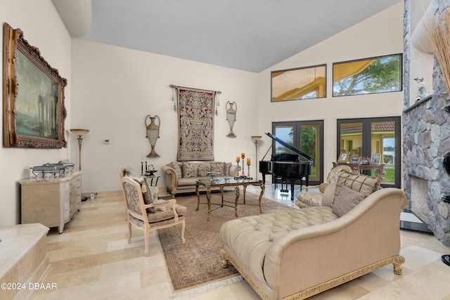 living room with french doors and a towering ceiling