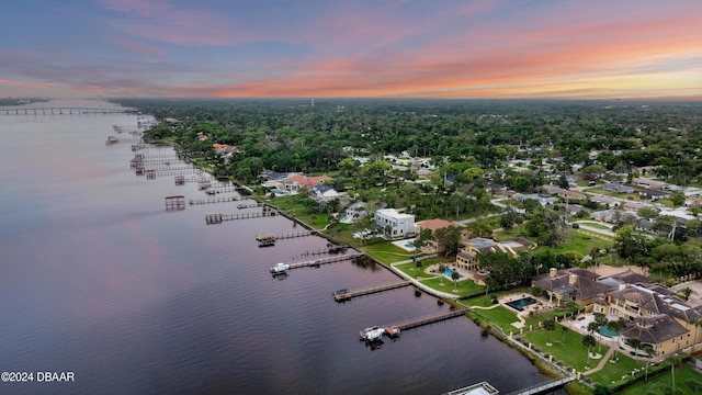 aerial view at dusk with a water view