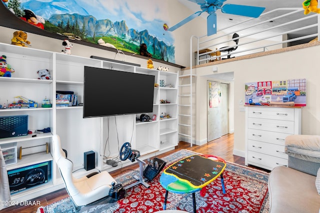 living room with light wood-type flooring and ceiling fan