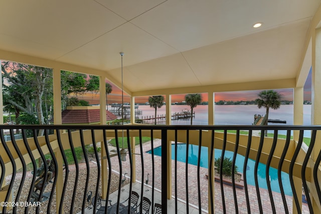 view of pool featuring a water view