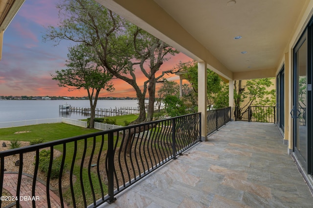 balcony at dusk with a water view