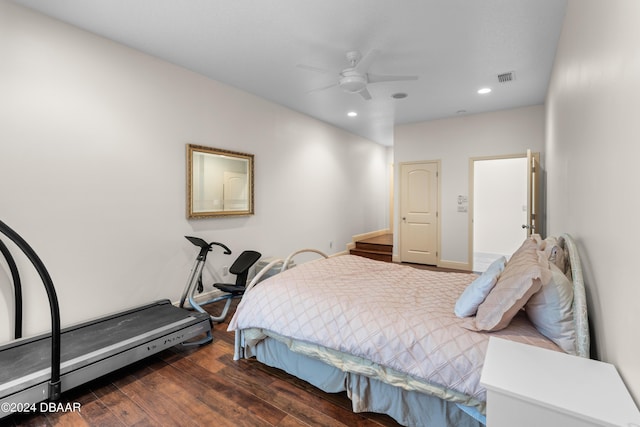 bedroom with ceiling fan and dark wood-type flooring