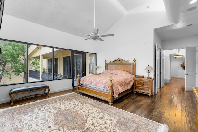 bedroom featuring ceiling fan, dark hardwood / wood-style floors, and lofted ceiling