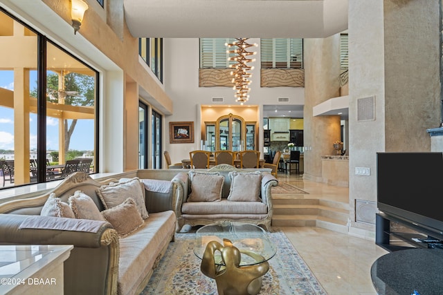 living room with a wealth of natural light and a towering ceiling