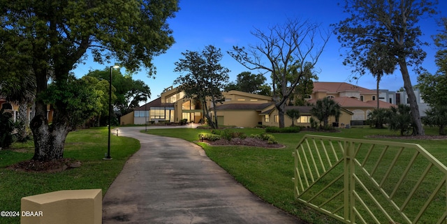 mediterranean / spanish-style house with a front yard