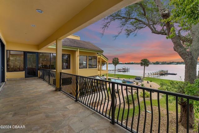 balcony at dusk with a water view