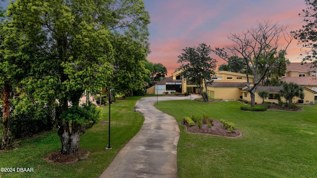 view of home's community featuring a lawn