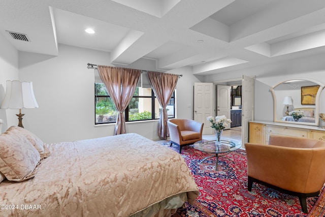 bedroom with beamed ceiling and coffered ceiling