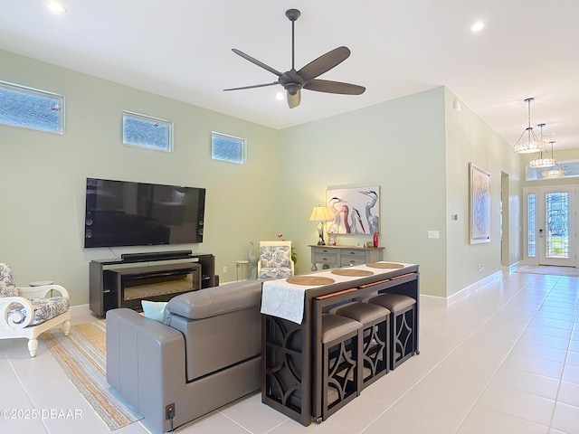 tiled living area featuring ceiling fan, recessed lighting, and baseboards