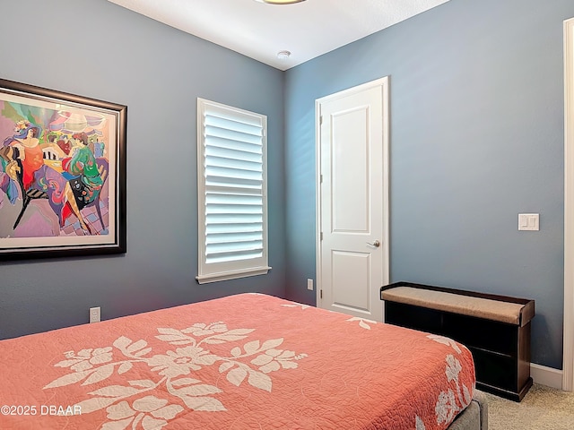 carpeted bedroom with baseboards