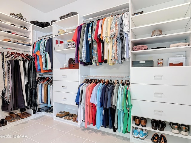 spacious closet featuring tile patterned flooring