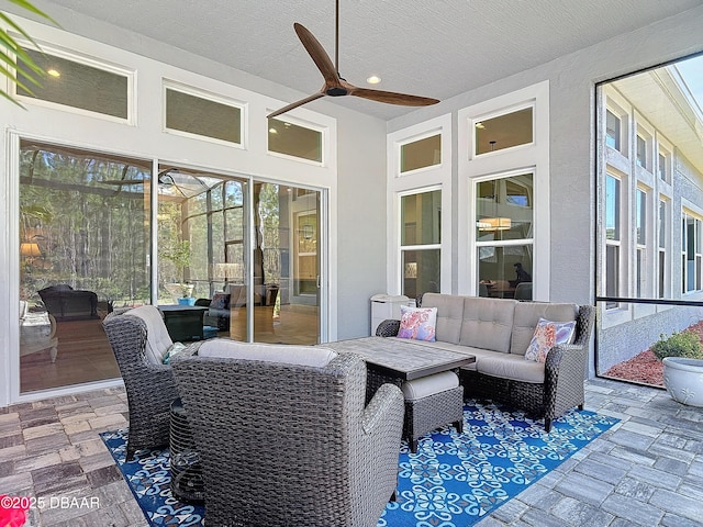 interior space with ceiling fan and an outdoor living space