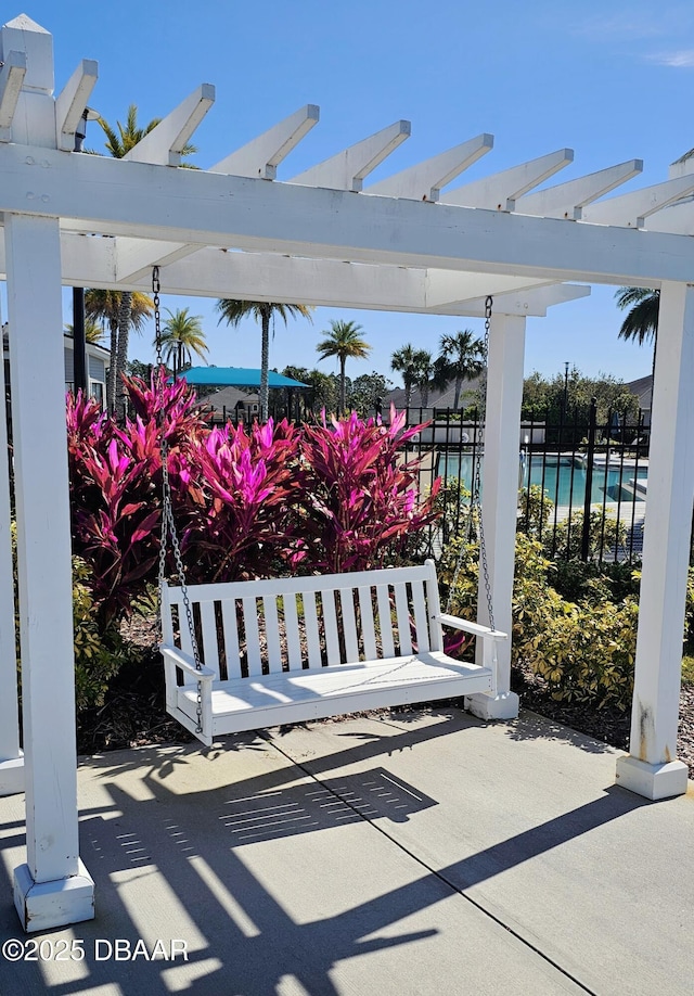 view of patio with fence and a pergola