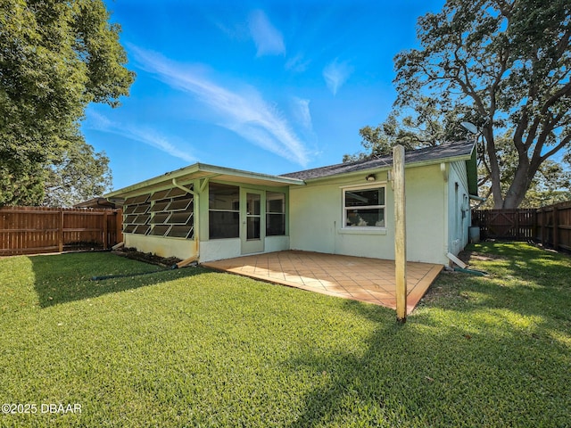 708 Egret Ct, Edgewater, FL 32141 - rear view of property featuring stucco siding, a sunroom, and a patio area