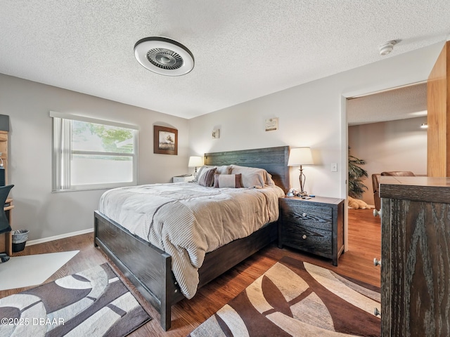 708 Egret Ct, Edgewater, FL 32141 - bedroom featuring wood finished floors, a textured ceiling, and baseboards