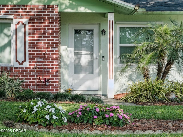708 Egret Ct, Edgewater, FL 32141 - entrance to property featuring brick siding and roof with shingles