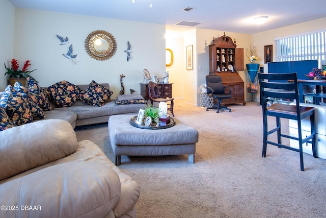 carpeted living area with visible vents