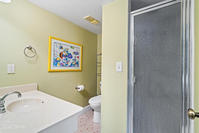 bathroom with toilet, tile patterned floors, a shower with door, and sink