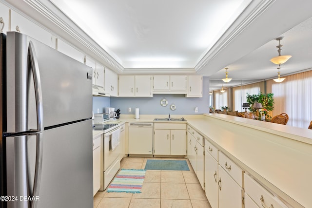 kitchen with decorative light fixtures, sink, light tile patterned floors, a tray ceiling, and white appliances