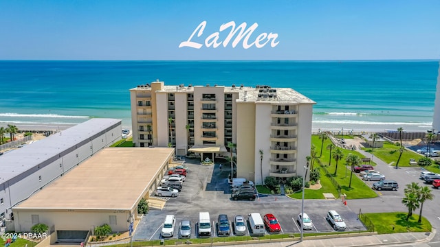 aerial view featuring a view of the beach and a water view