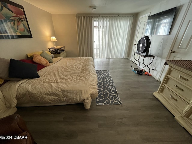 bedroom featuring dark wood-type flooring