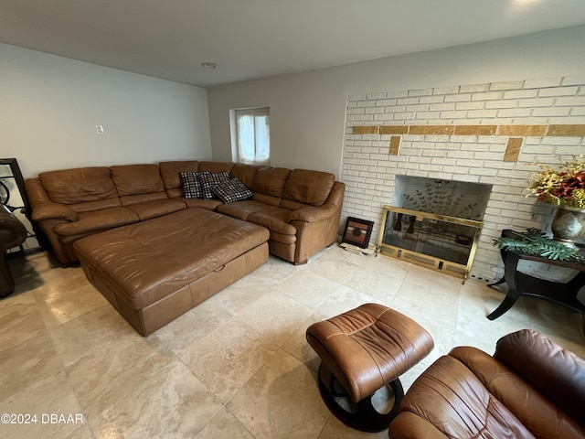 living room with a brick fireplace