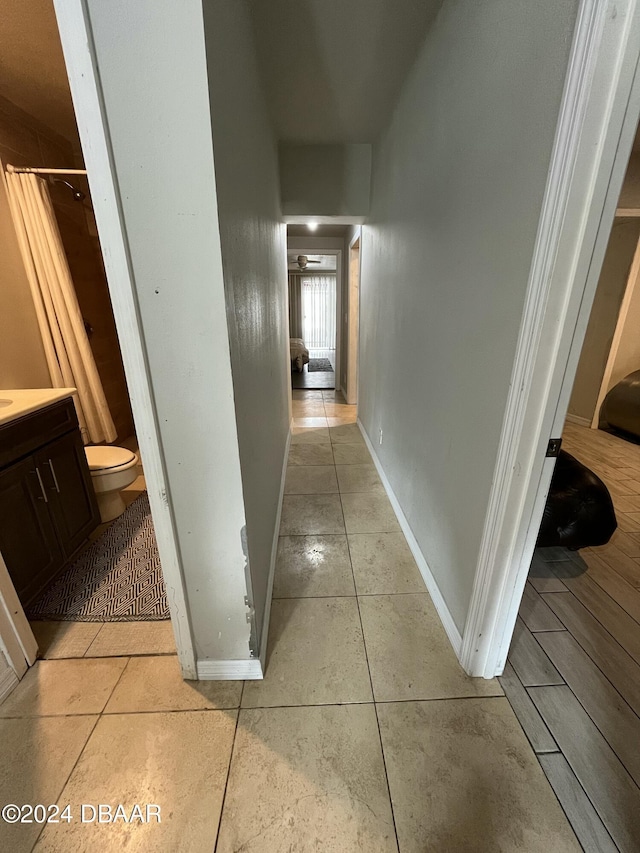 corridor with light tile patterned floors