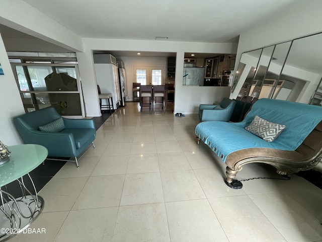 living room with light tile patterned flooring