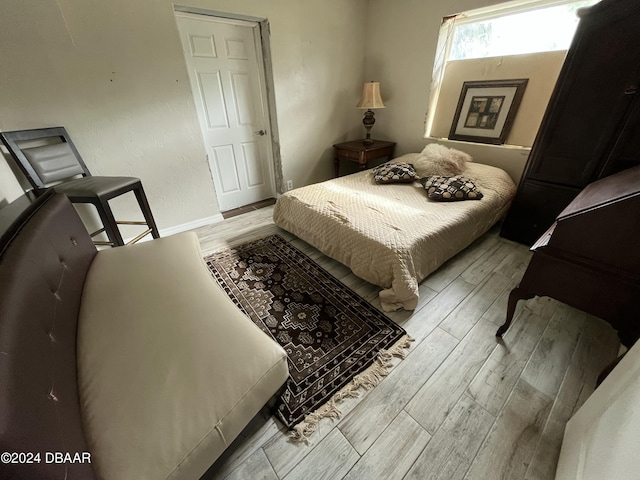 bedroom with light hardwood / wood-style floors