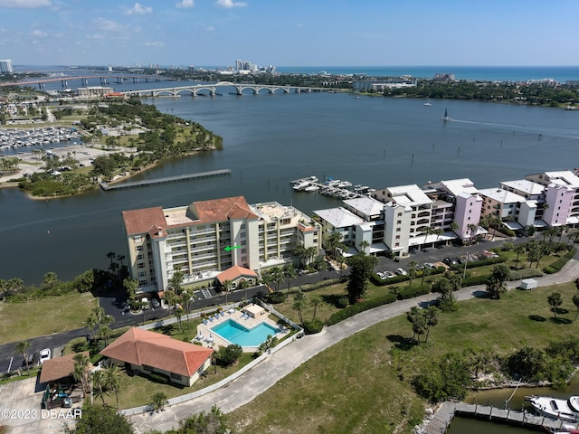 birds eye view of property with a water view