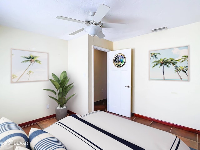 bedroom featuring baseboards, ceiling fan, visible vents, and tile patterned floors