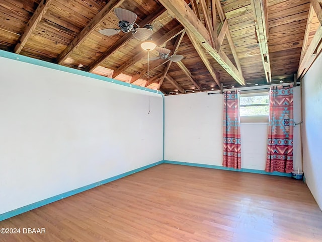 unfurnished room with ceiling fan, wood finished floors, wood ceiling, and baseboards